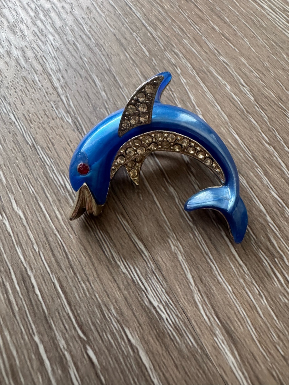 Vintage dolphin metal brooch with rhinestones